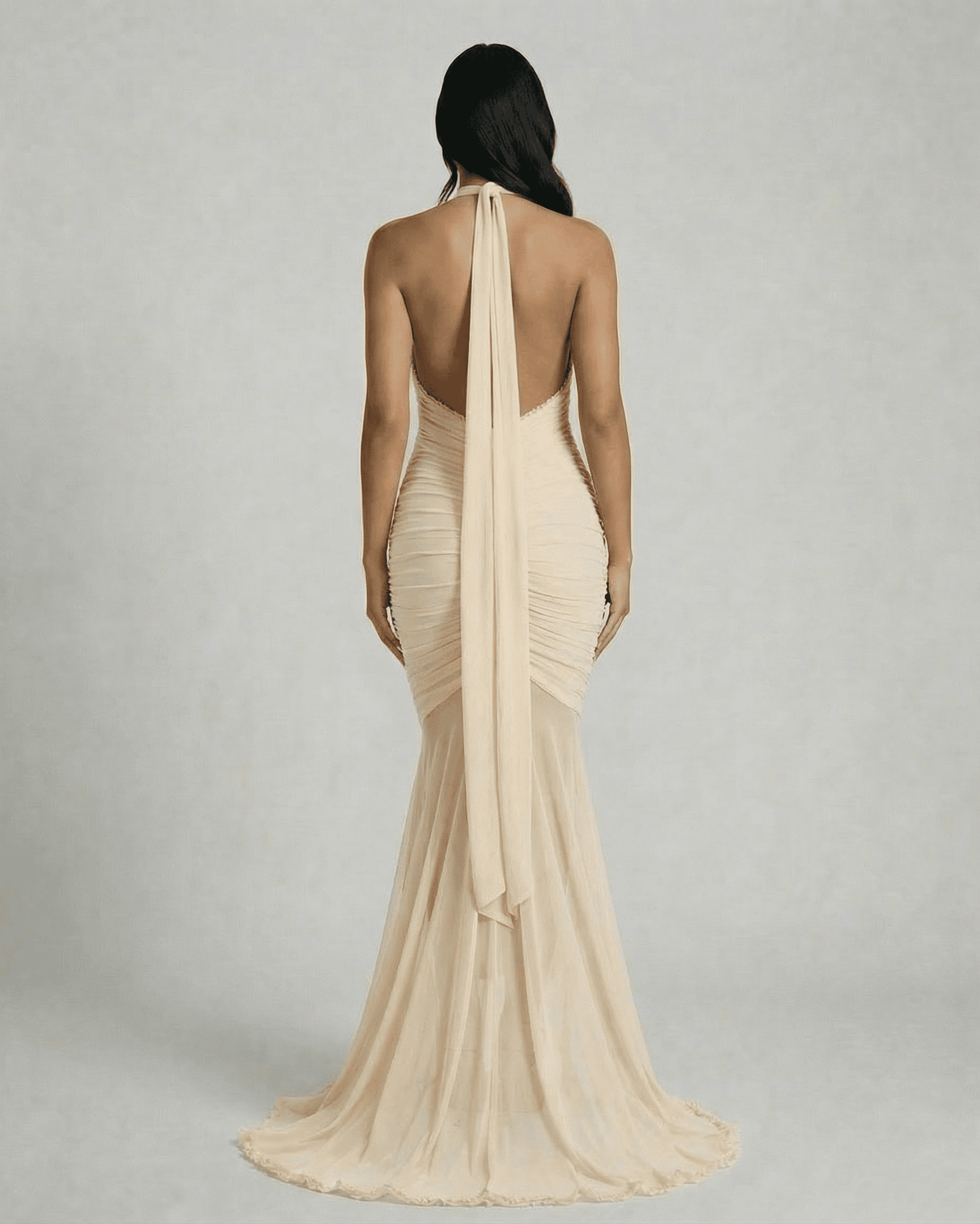 Elegant back view of the Slimona Champagne Maxi Dress with ruched design and flowing hem.