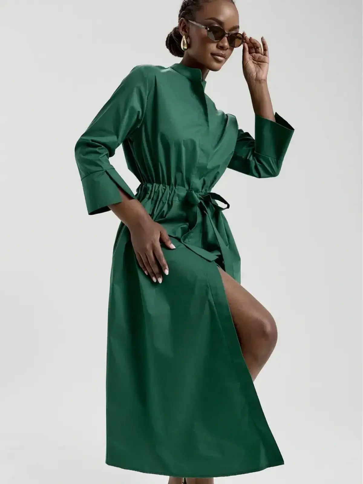 Emerald Ease Midi Dress in green with a structured collar, waist tie, and elegant silhouette, perfect for summer and special occasions.