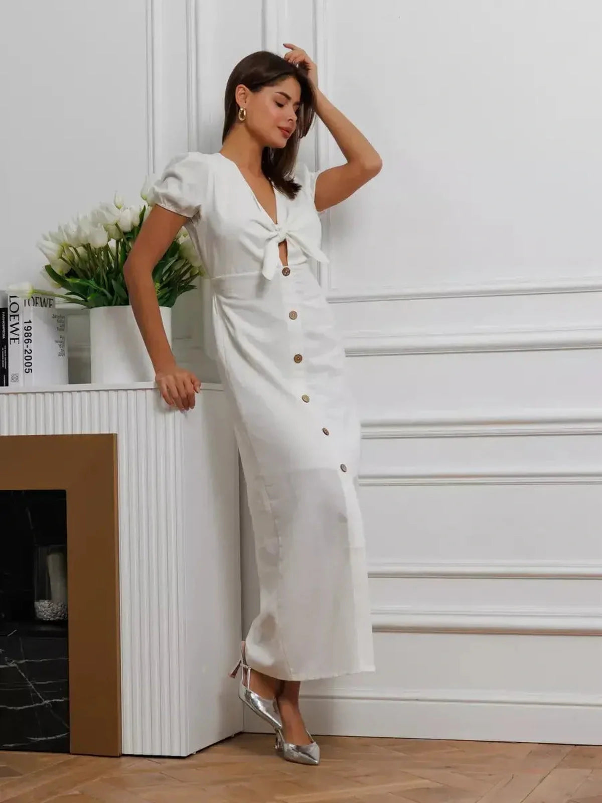 Elegant white maxi dress with tie-front and puff sleeves, perfect for weddings, proms, and summer events.