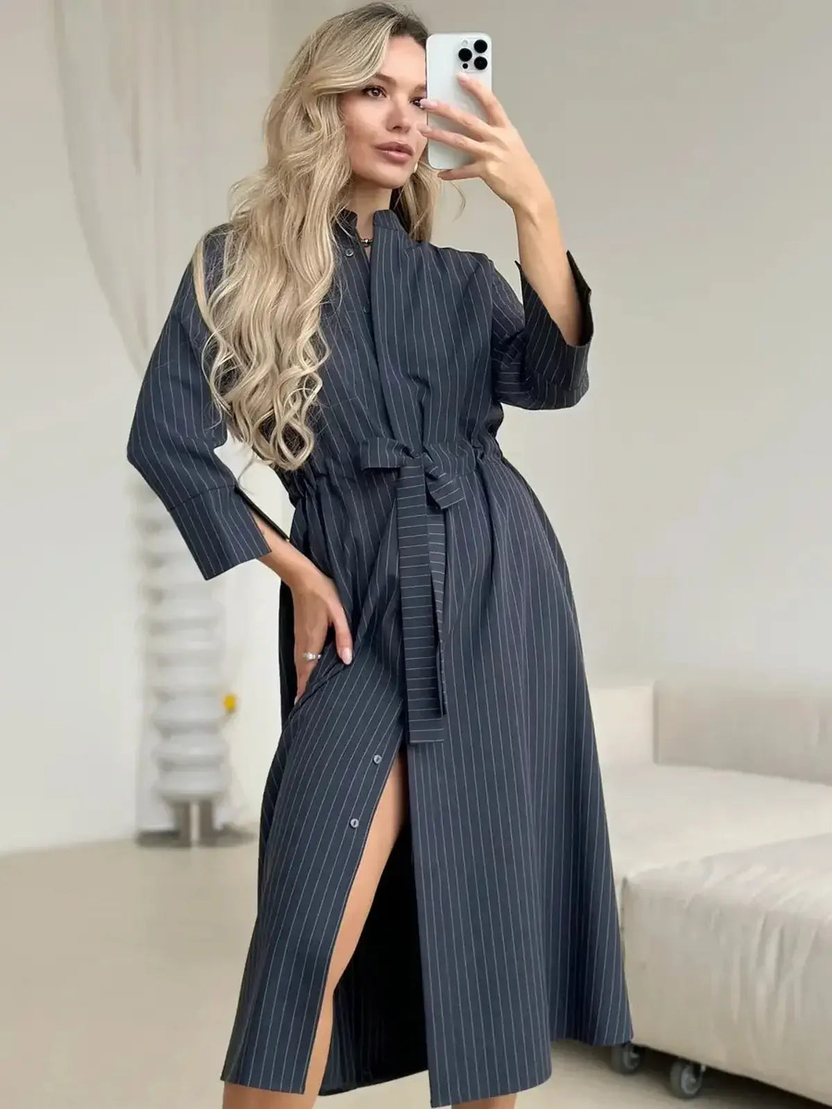 Slate Stripe Midi Dress with a relaxed fit, featuring vertical pinstripes and a soft waist tie, perfect for versatile styling.