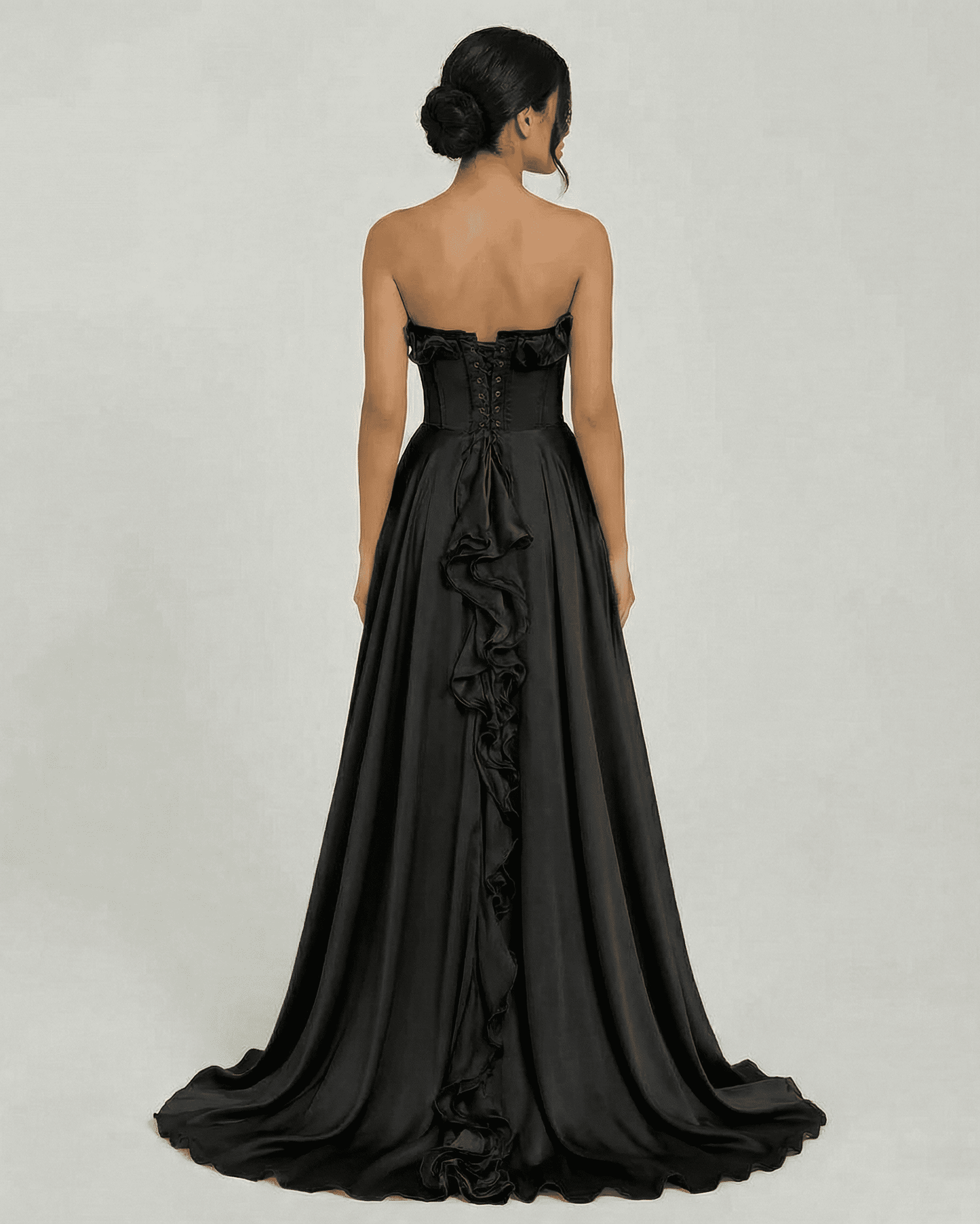 Back view of Noirelle Maxi Dress by Slimona, featuring strapless design and elegant ruffle detail.