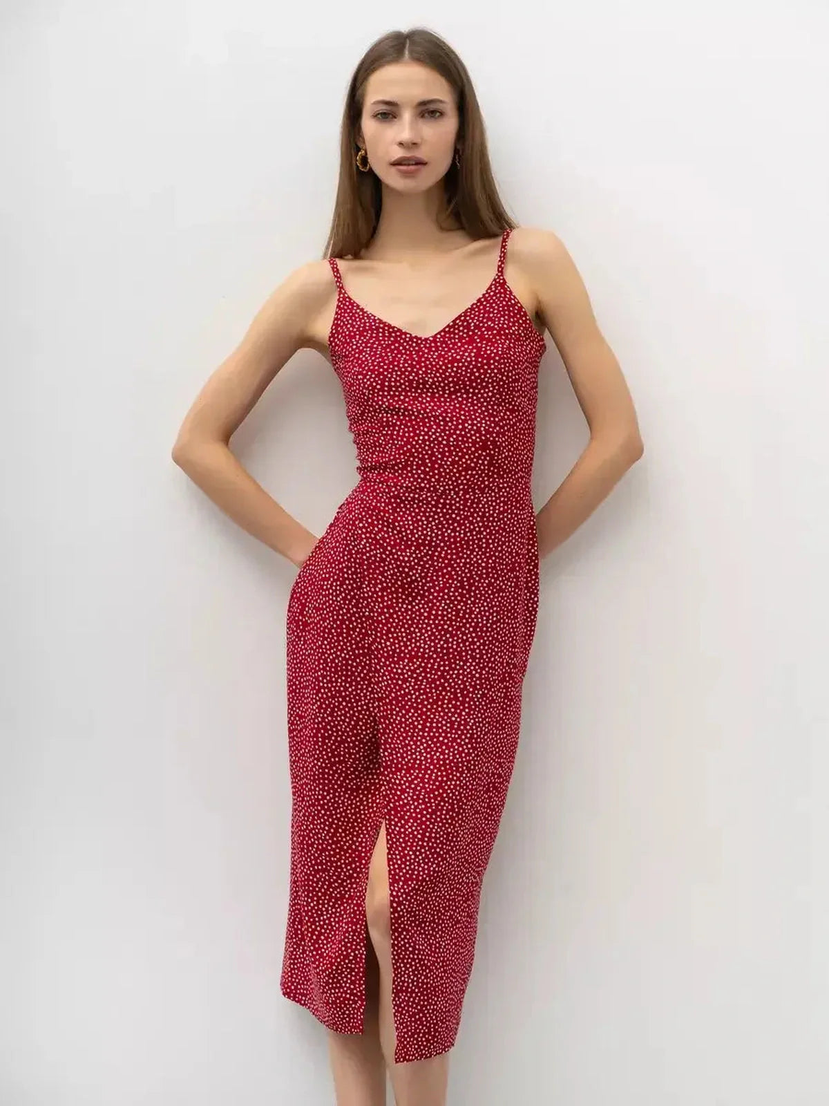 Cherry Dots Midi Dress in red with white polka dots, featuring a V-neckline and stylish wrap design.