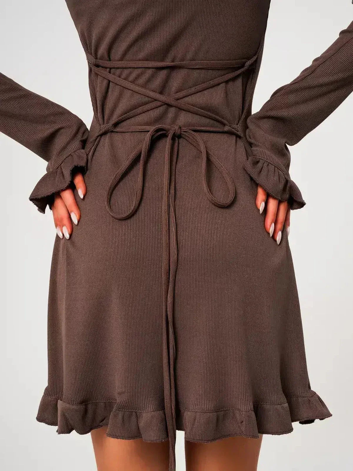 Back view of the Mocha Flare ribbed knit mini dress featuring flared cuffs and a trendy lace-up detail.