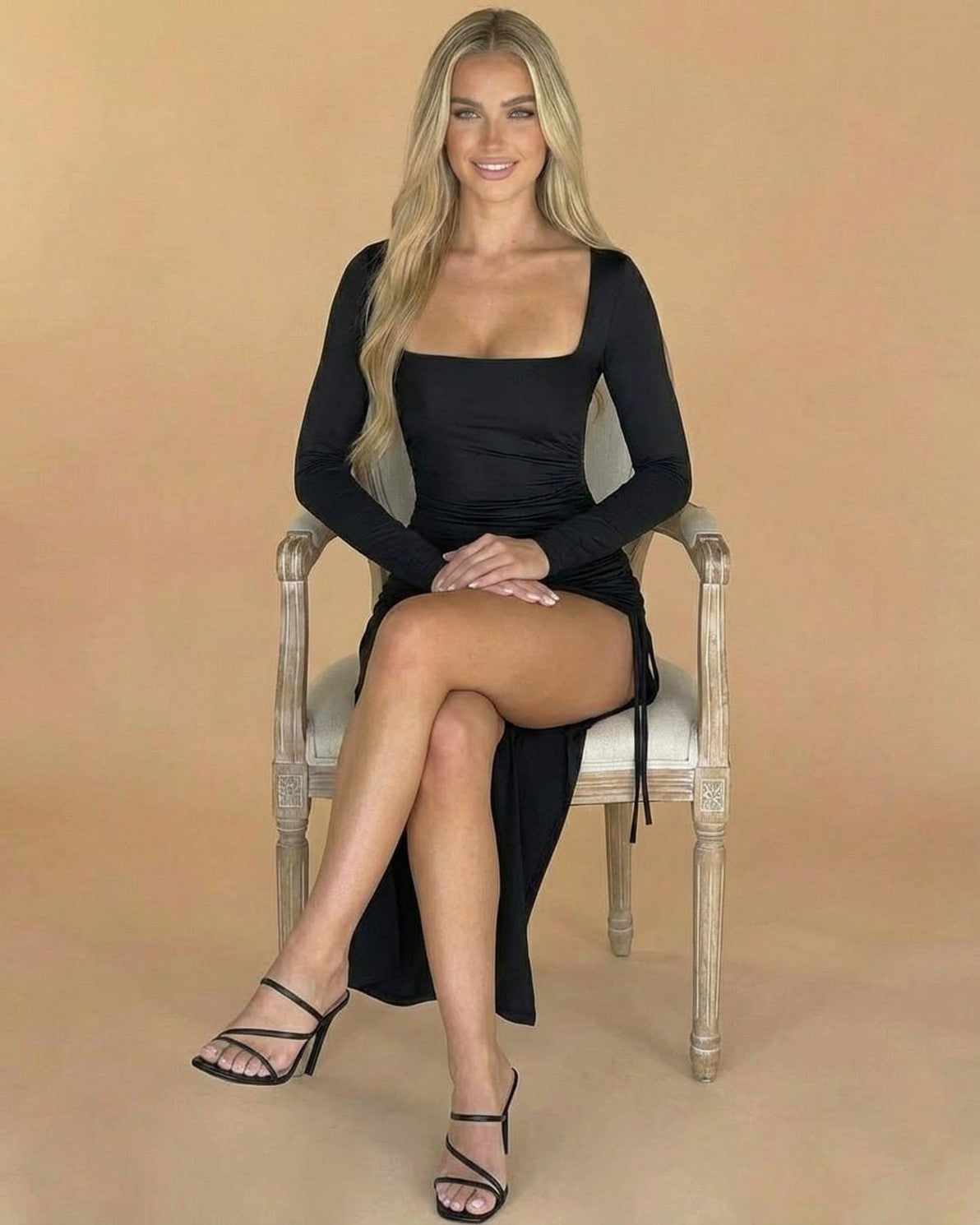 Model wearing the Nocturne Midi Dress by Slimona, showcasing its sleek design and elegant silhouette.