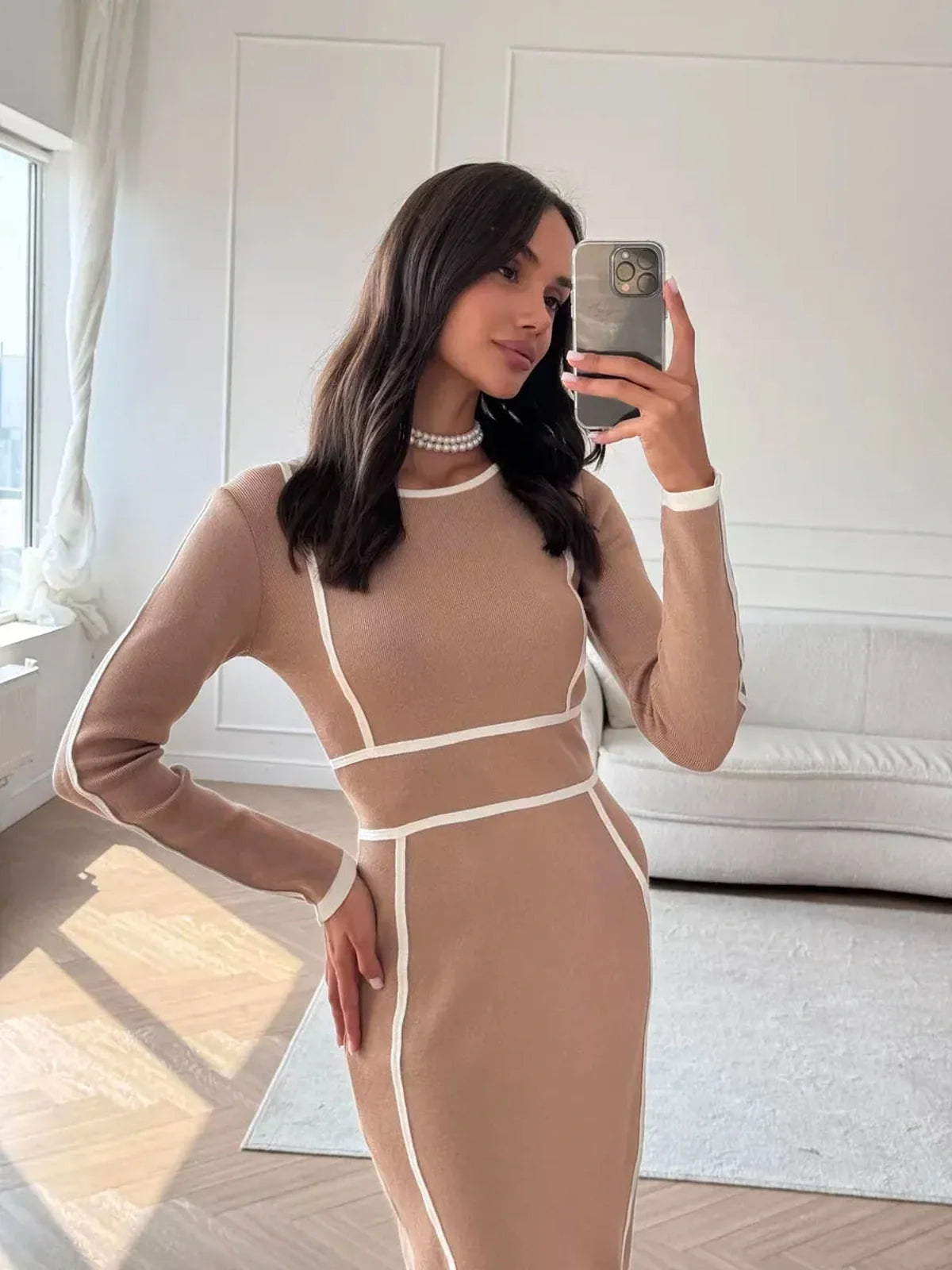 Chic Outline Midi Dress in soft sand with bold white trim, perfect for weddings, formals, and evening occasions.