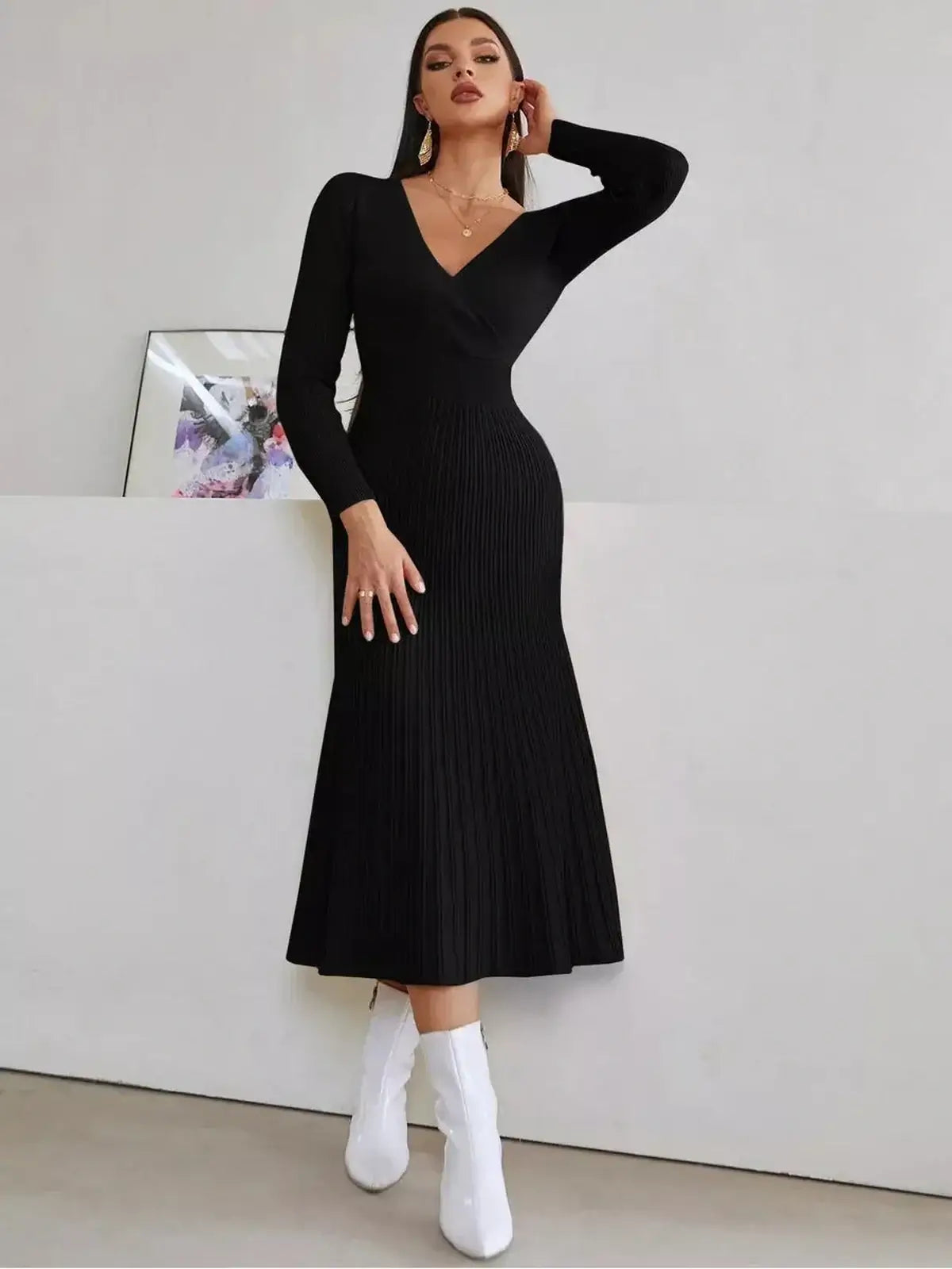Sculpted Grace Midi Dress in black, featuring a fitted silhouette and ribbed texture, perfect for formal and casual occasions.