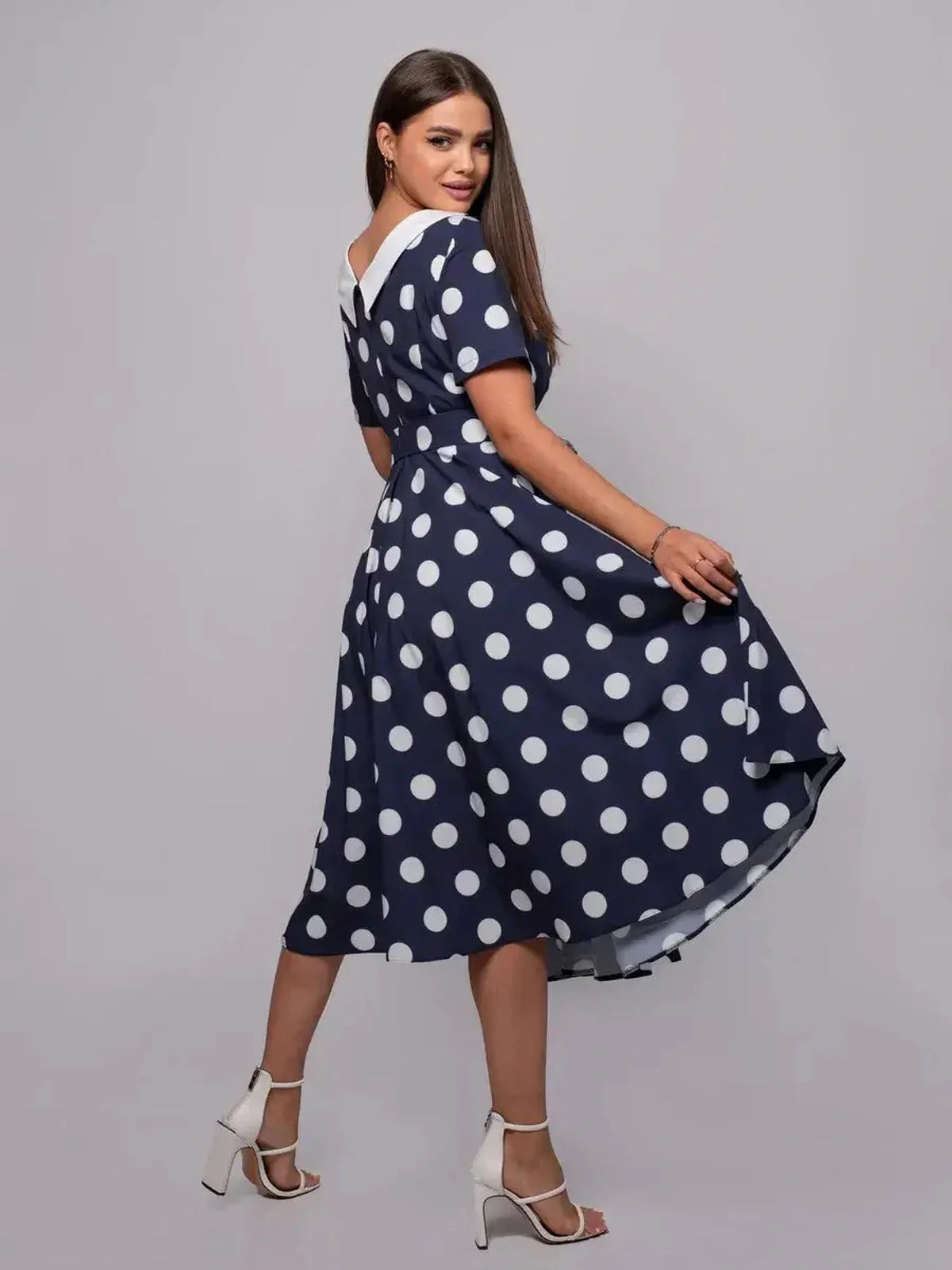 Nautical Charm Midi Dress featuring classic polka dots, flared skirt, and a white flat collar, perfect for summer events.