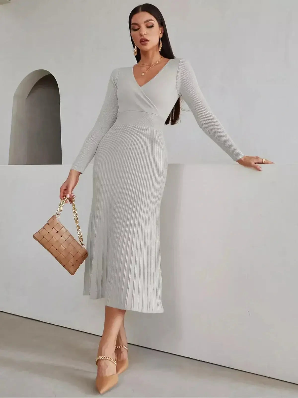 Elegant woman in a Sculpted Grace Midi Dress with ribbed texture, perfect for weddings or formal occasions.