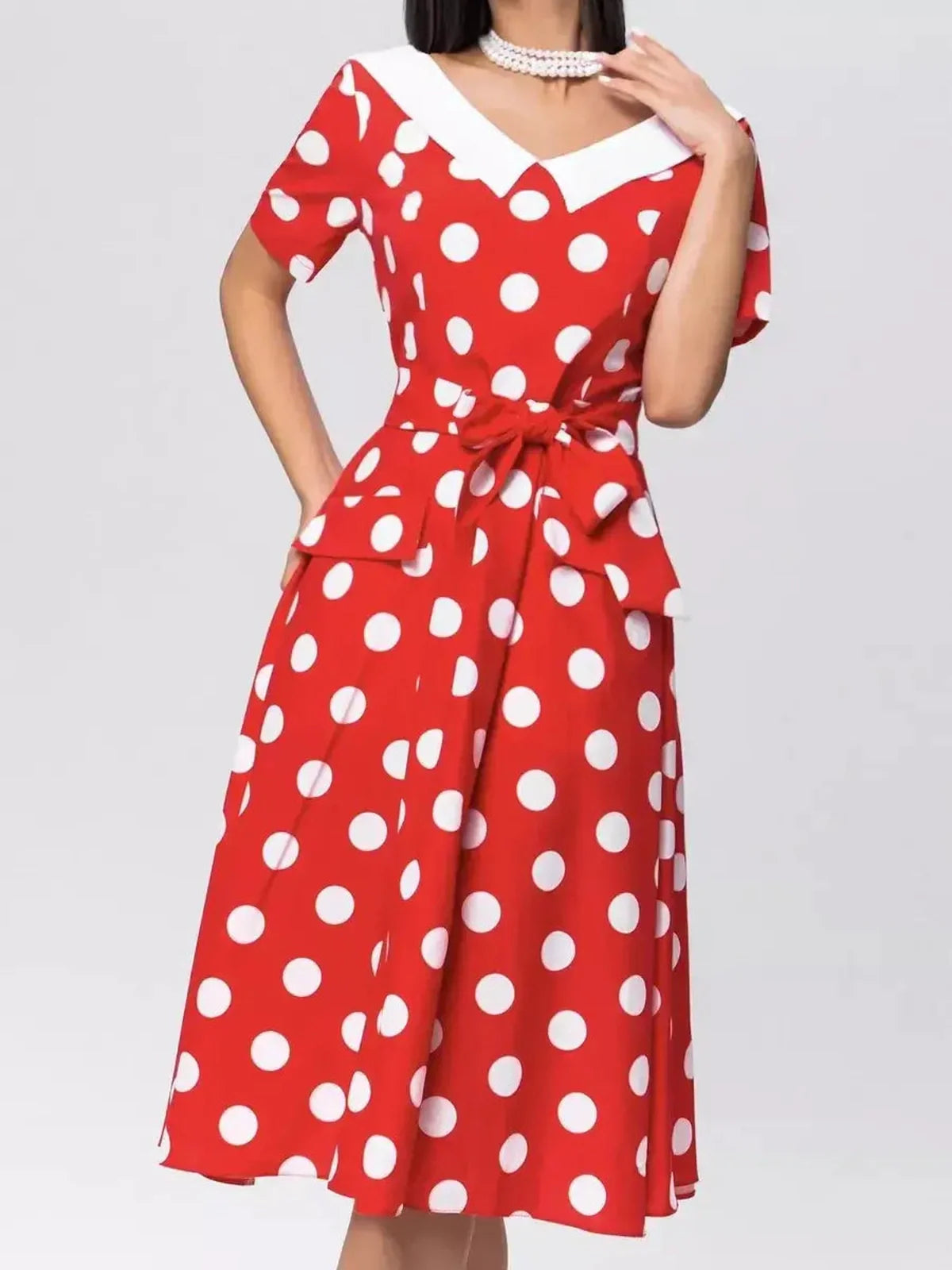 Retro Charm Midi Dress in red and white polka dots with a flattering V-neckline and tie belt, perfect for summer events.