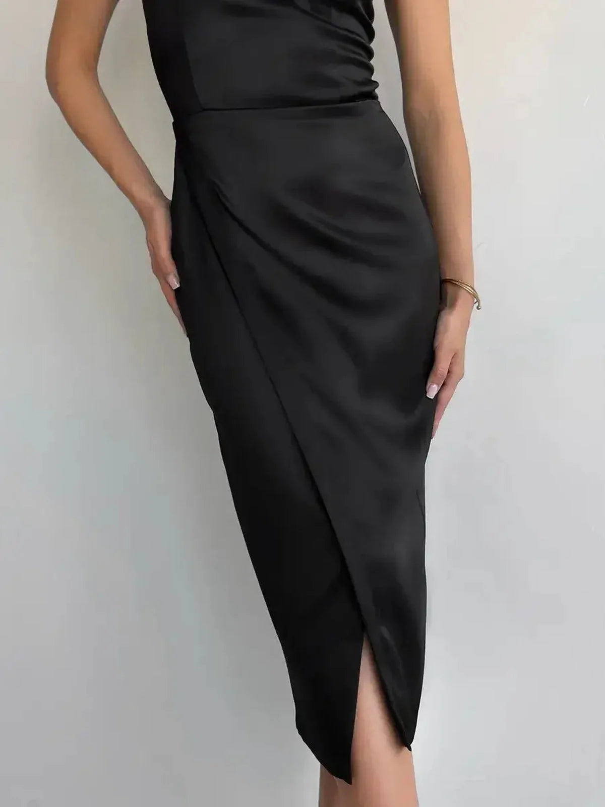 Eclipse Midi Dress in black satin featuring a wrap silhouette and daring side slit, perfect for formal occasions.