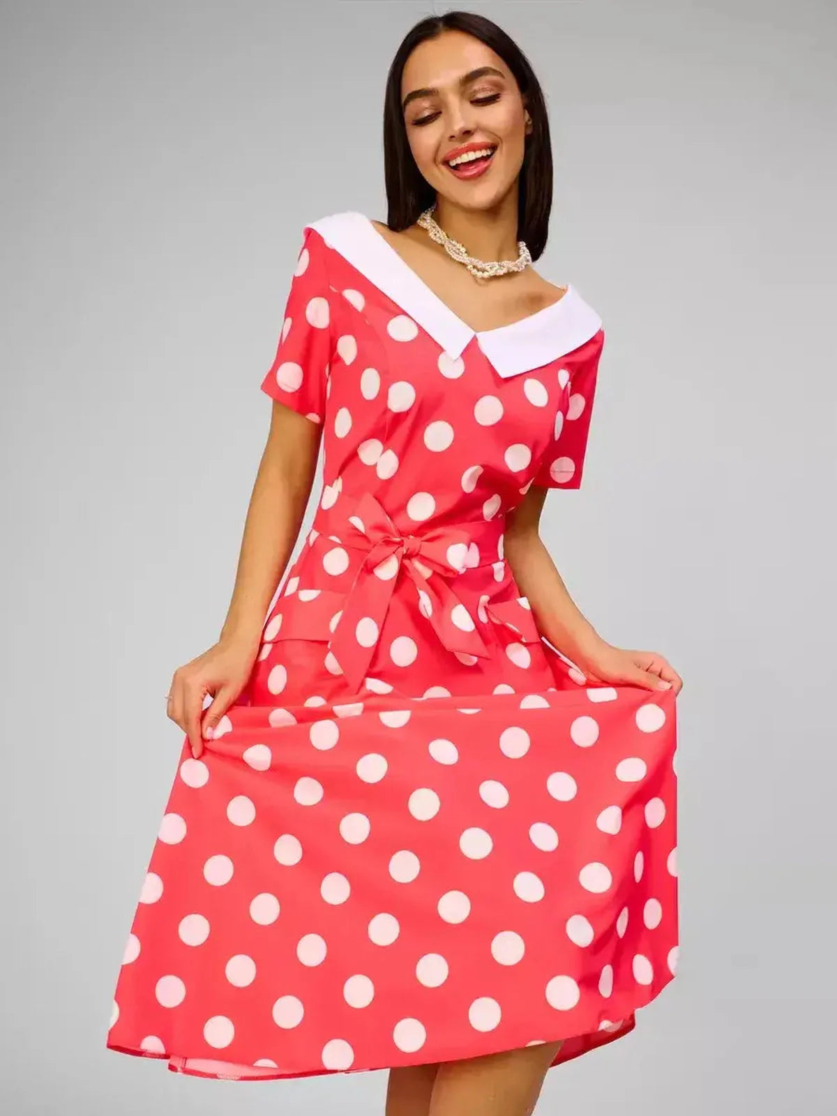 Sailor Chic Midi Dress in vibrant pink with white polka dots and sailor collar, perfect for summer weddings and casual outings.