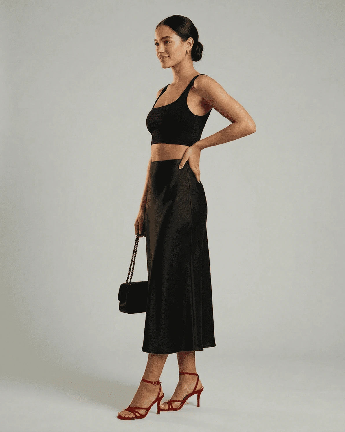 Noirelle Midi Skirt – Black Satin midi skirt, back view by Slimona