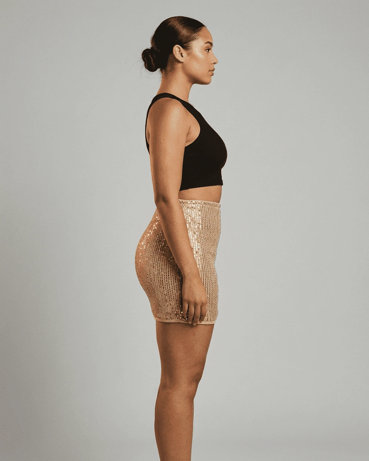 Lumiere Mini Skirt – Light Gold Sequin mini skirt, detail view by Slimona