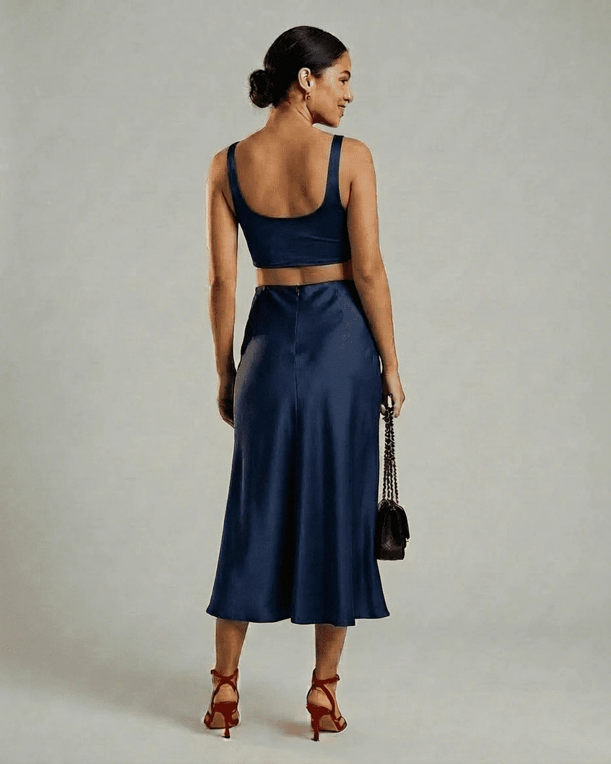 Astra Midi Skirt – Navy Satin midi skirt, model wearing by Slimona