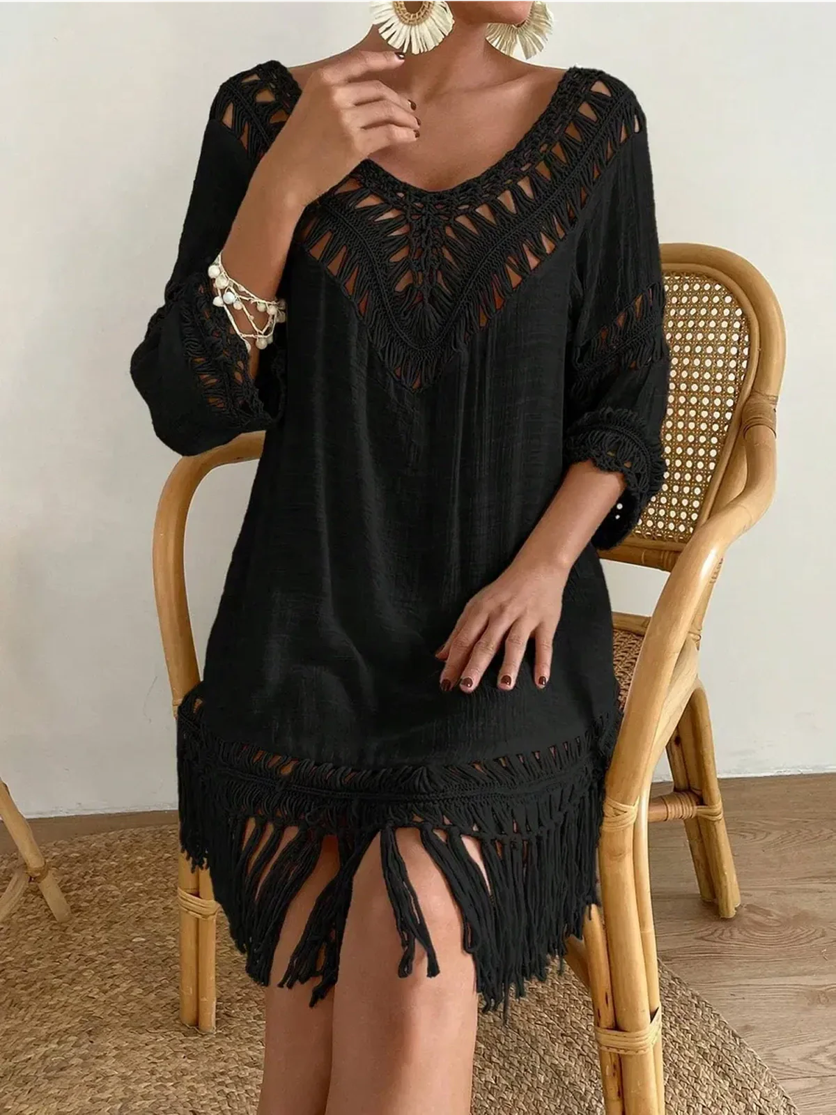 Stylish Boho Fringe black mini dress with lace trim and fringe hem, perfect for summer or casual outings.