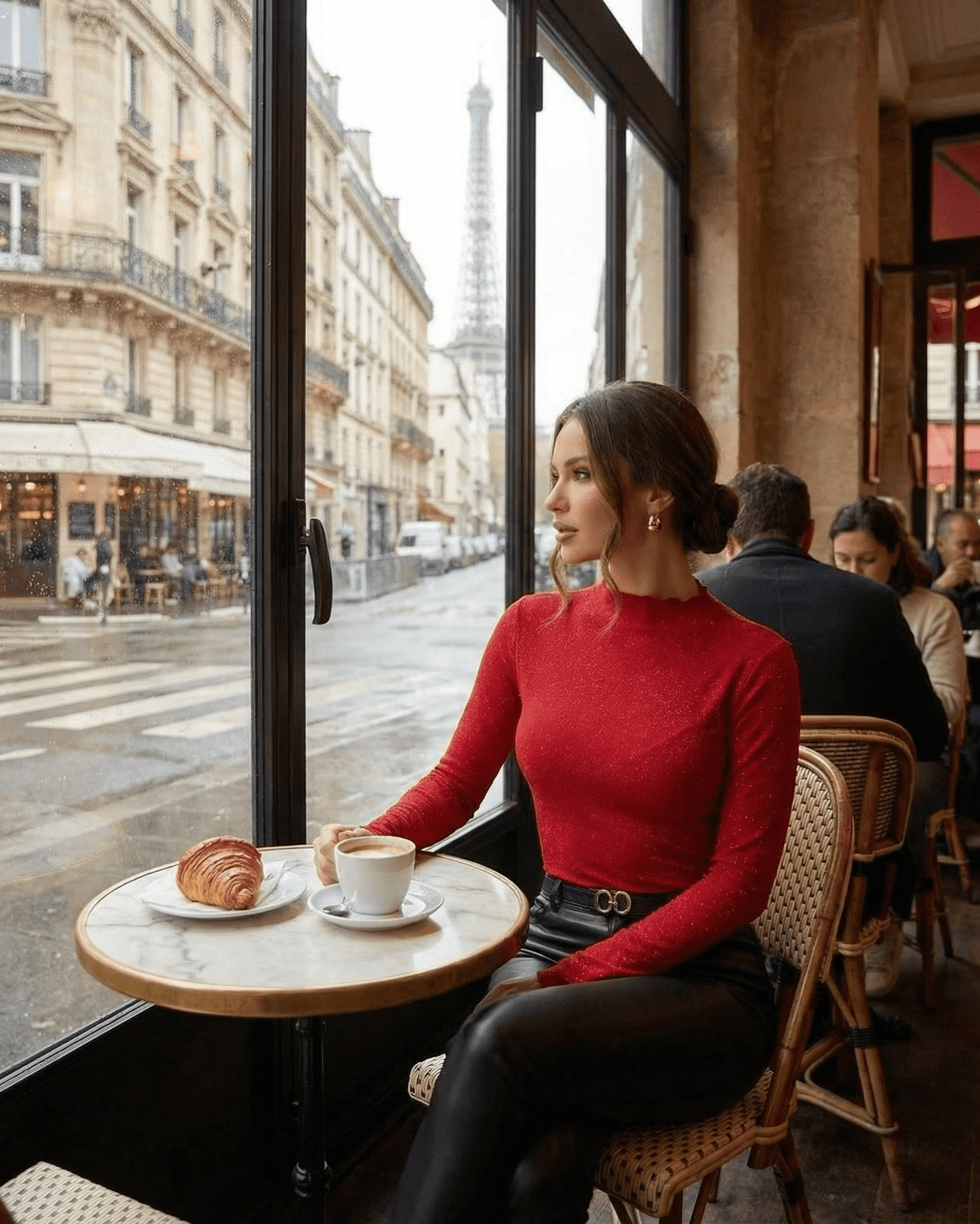 Woman wearing a Scarlet Blouse by Slimona, enjoying coffee with a view of the Eiffel Tower.