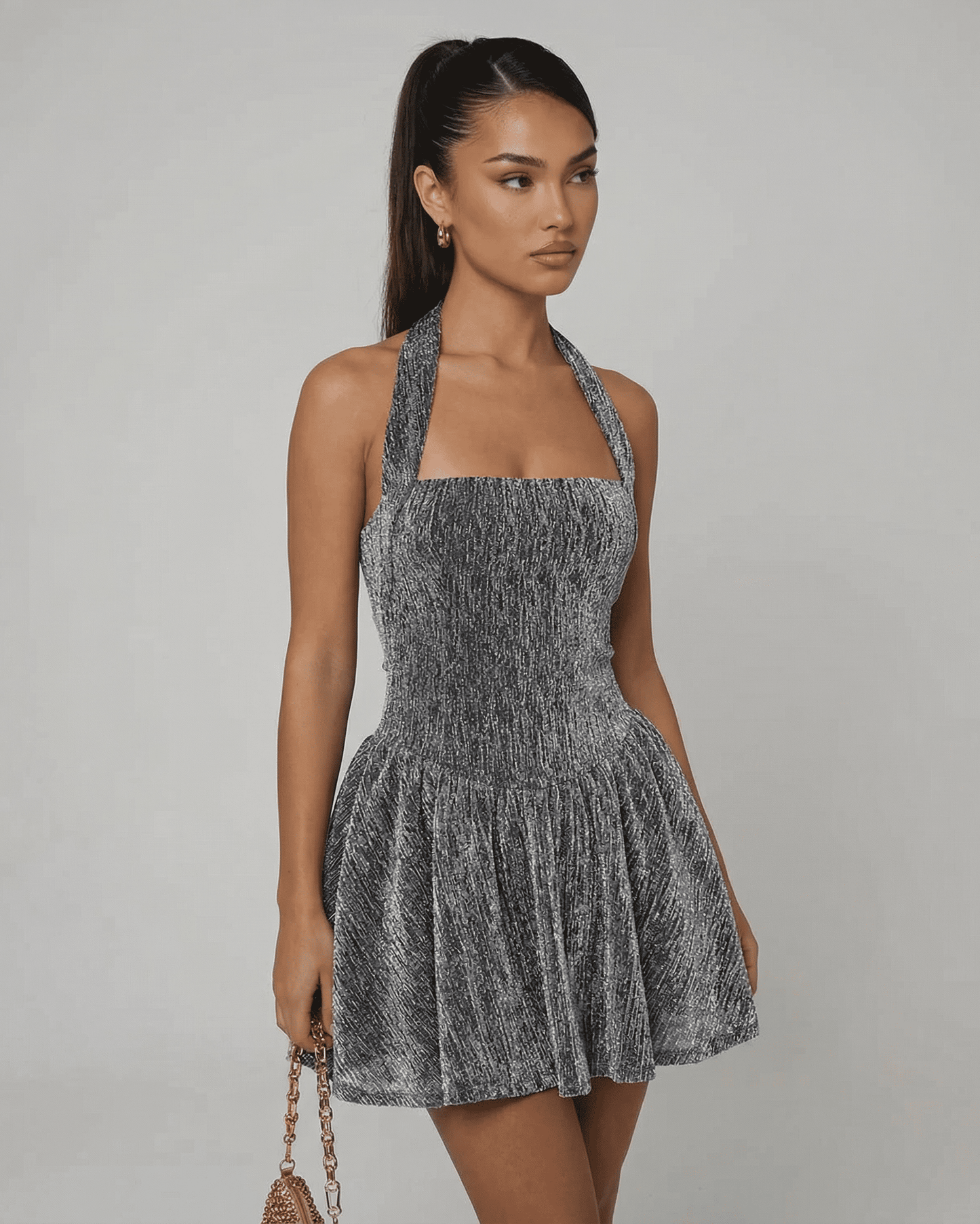 Celeste Mini Dress by Slimona featuring a shimmering A-line design and high waist finish in silver sequins.
