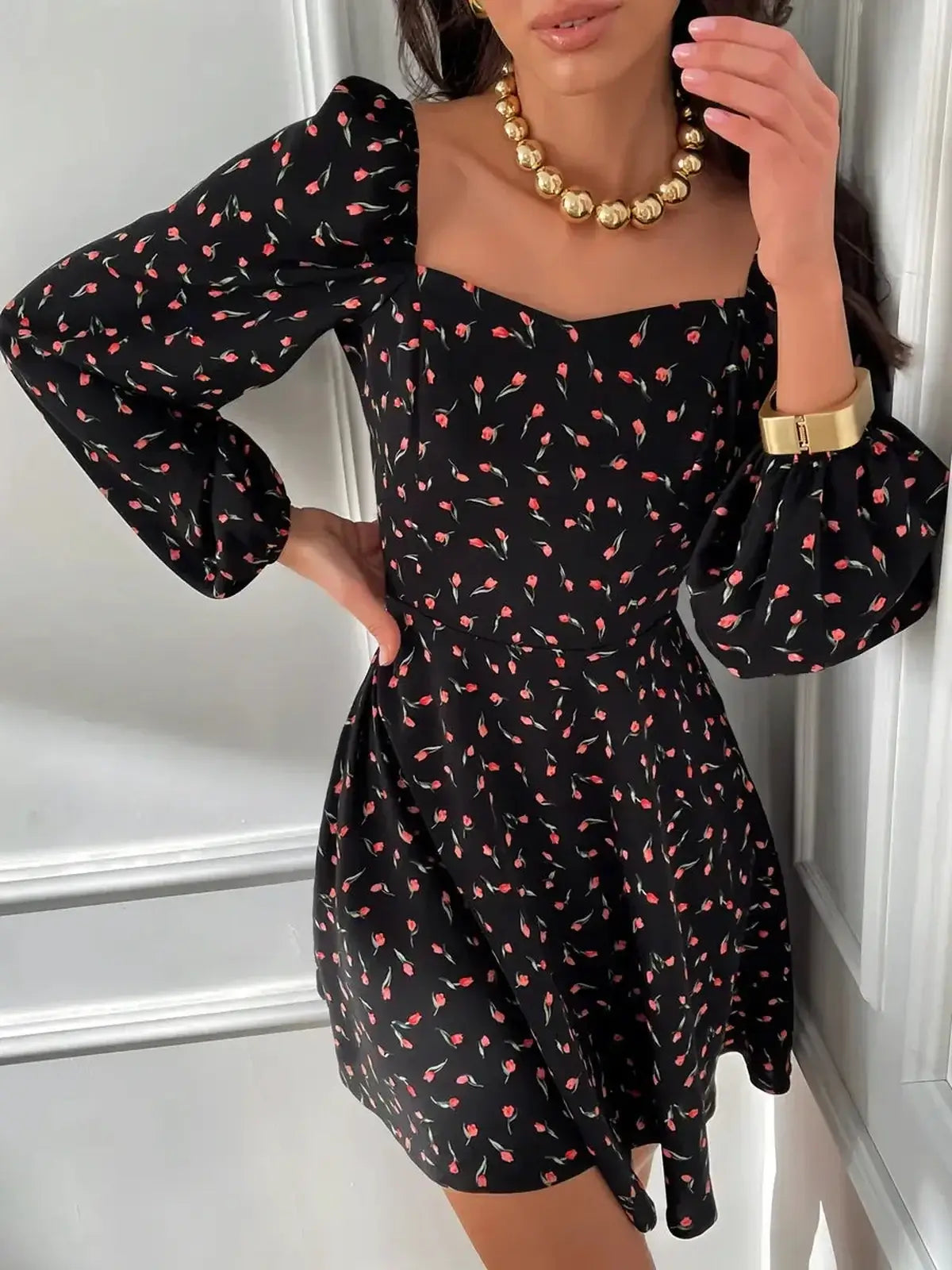 Elegant black mini dress with floral patterns and puffed sleeves, perfect for weddings, proms, and special occasions.