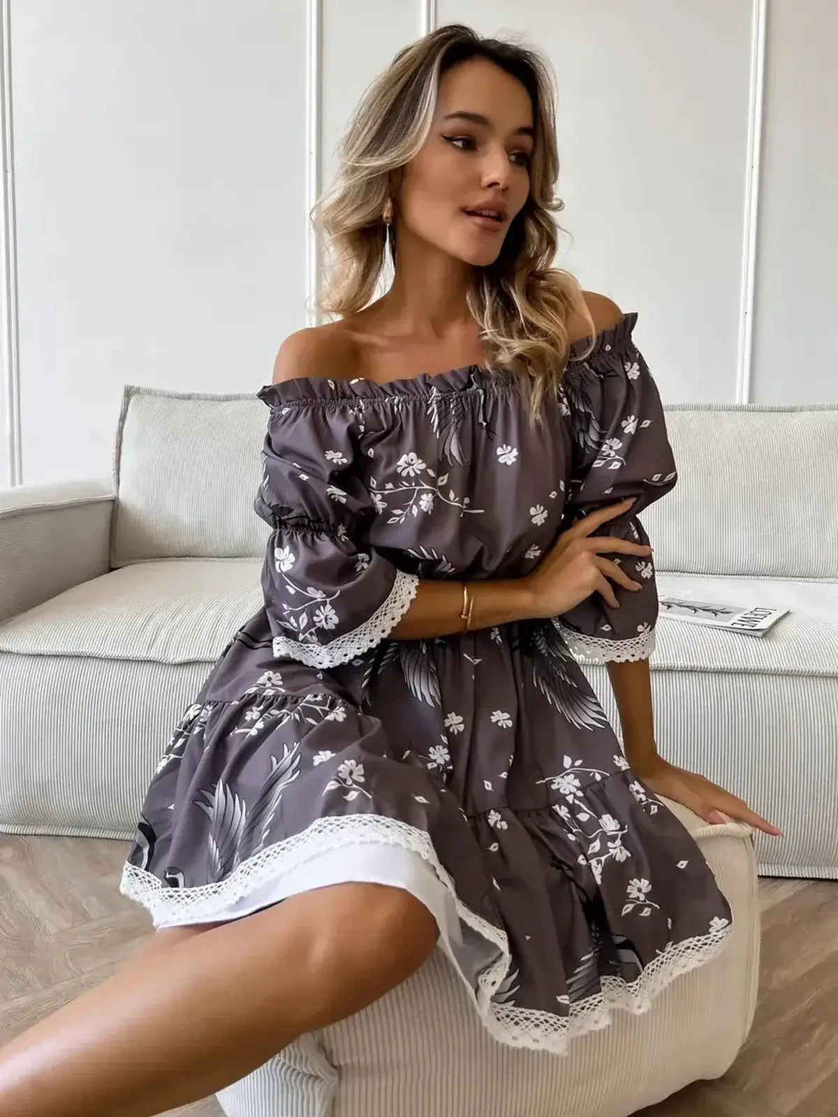 Sakura Flight mini dress with off-shoulder neckline and floral pattern, perfect summer dress for weddings or casual outings.