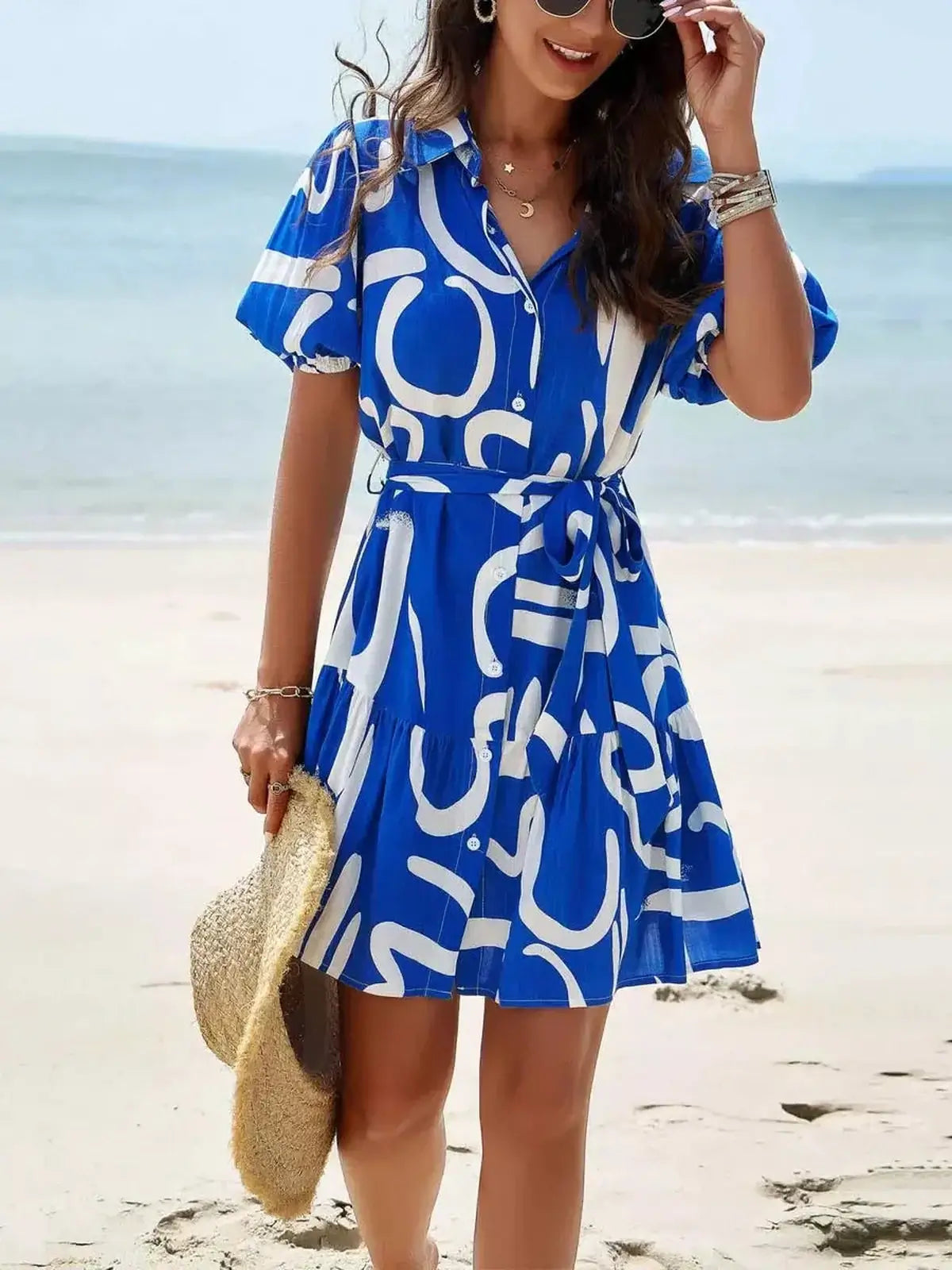 Ocean Script Mini Dress in blue-and-white abstract pattern, perfect for summer parties and beach outings.