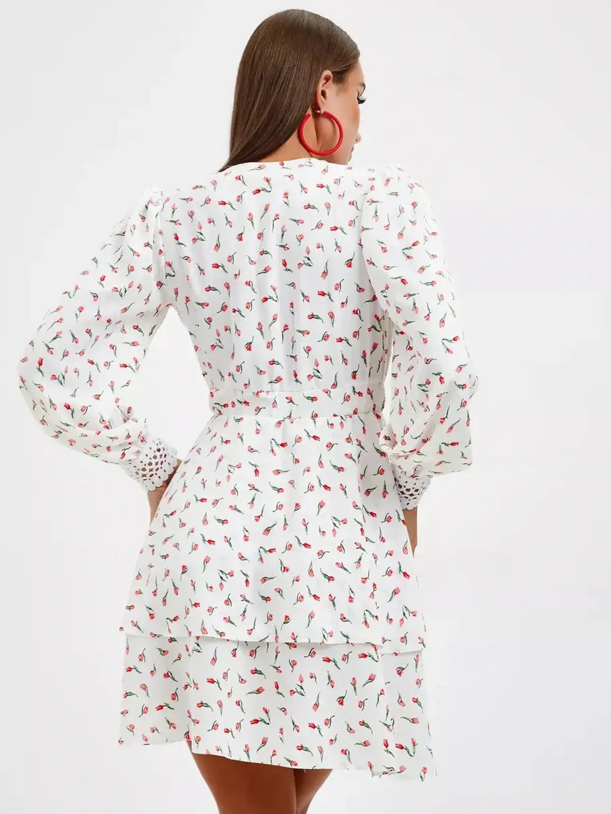 White mini dress with delicate rosebud print, perfect for summer parties and weddings.