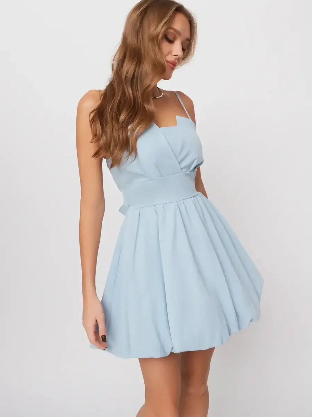 Skye Mini Dress in soft pastel blue, featuring an A-line silhouette and playful open-back design, perfect for summer occasions.