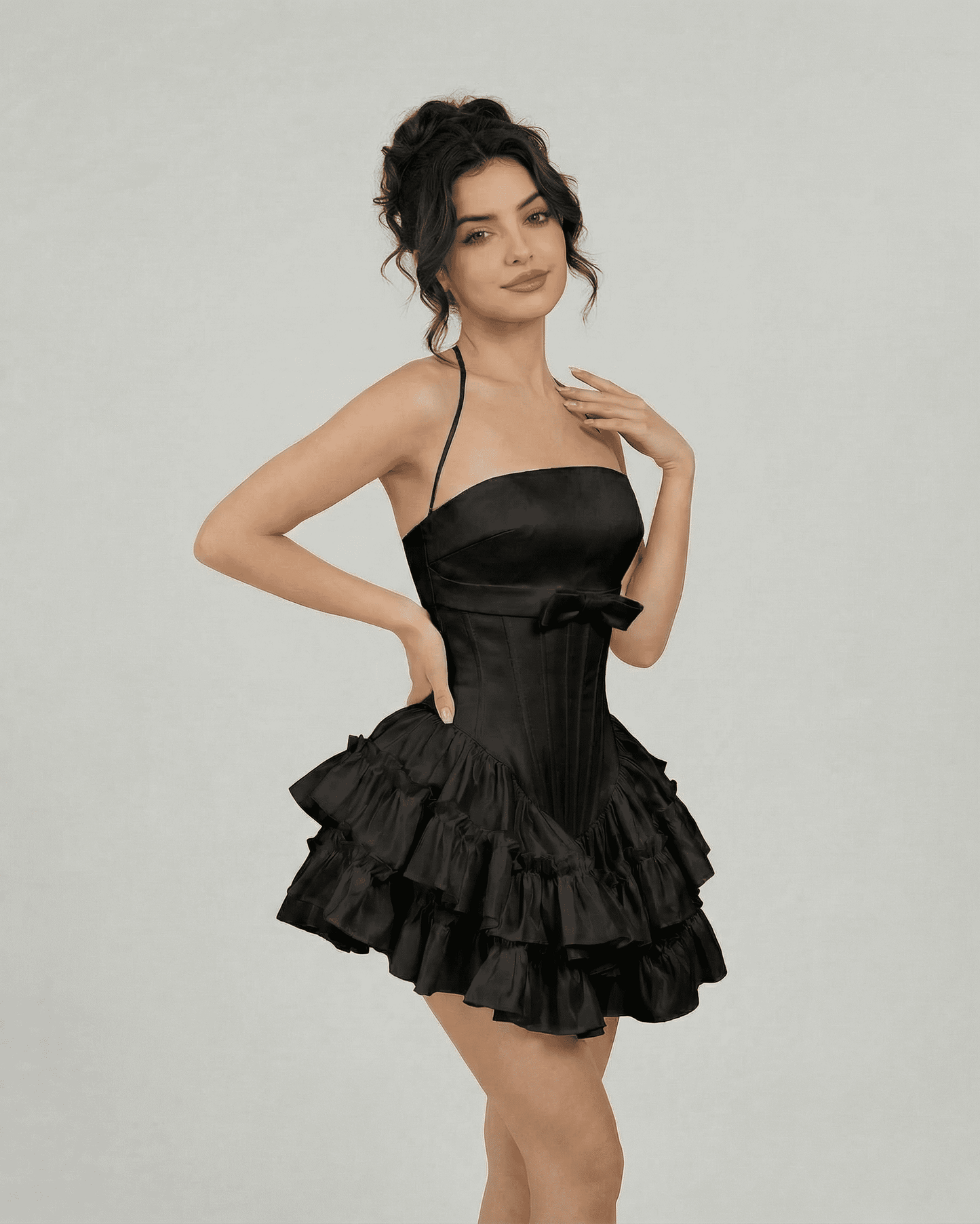 Noir Mini Dress by Slimona, featuring a corset-style bodice and tiered skirt in classic black.