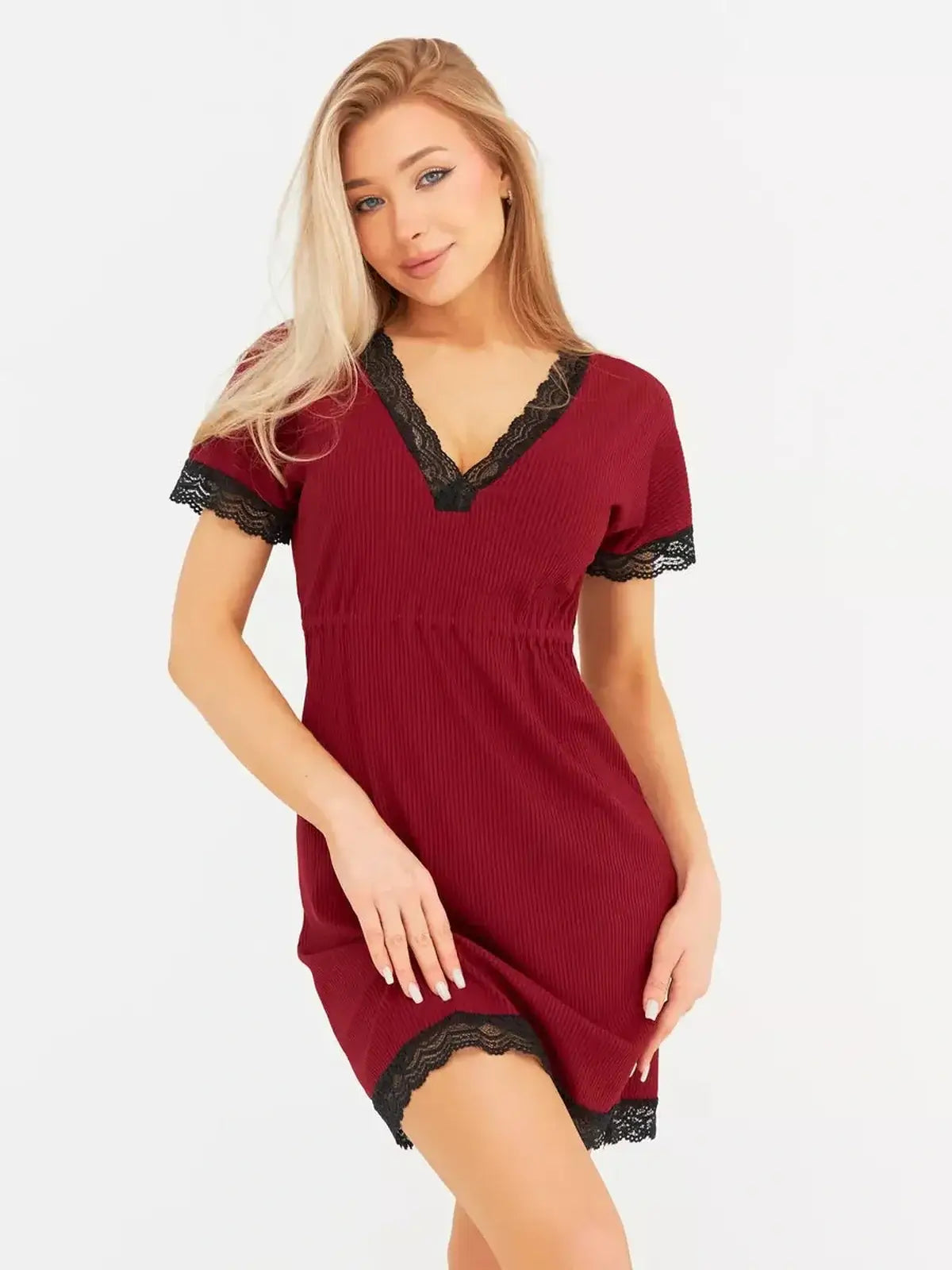 Model wearing Velvet Hour mini dress in rich red with black lace trim and flutter sleeves, perfect for wedding guest or cocktail events.