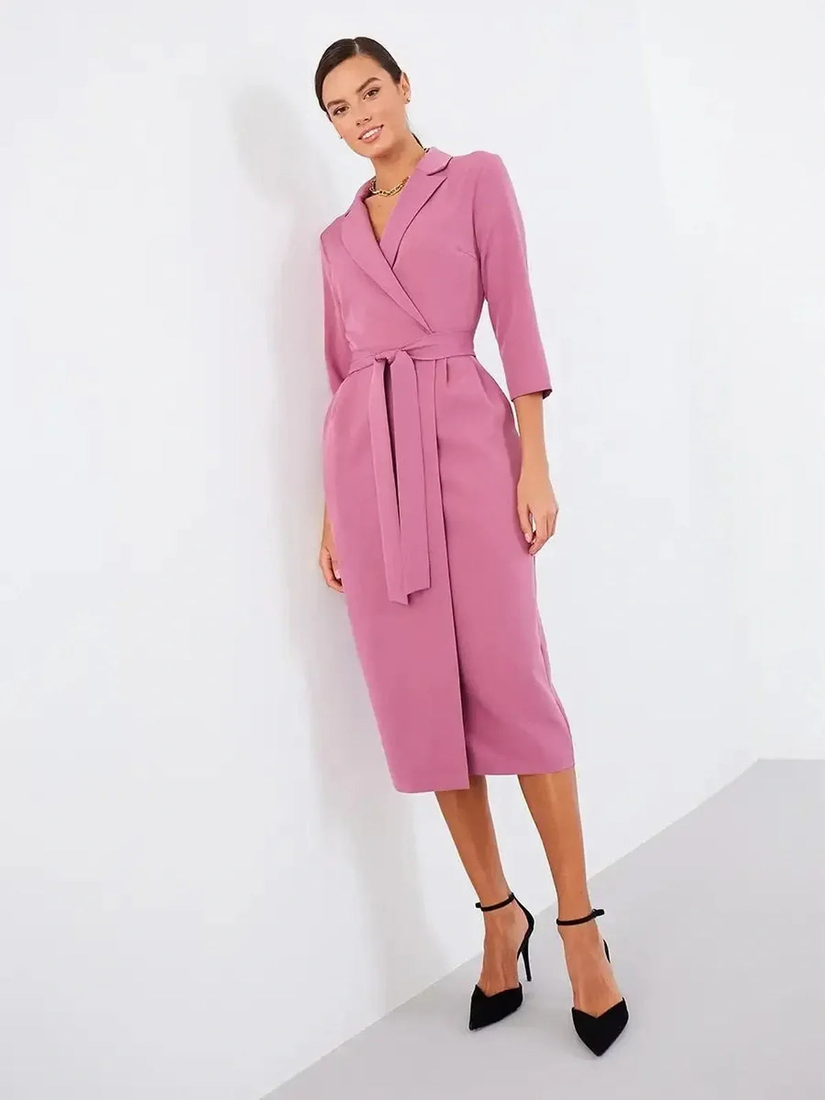 Blush wrap midi dress with belted waist and three-quarter sleeves, perfect for weddings and formal occasions.