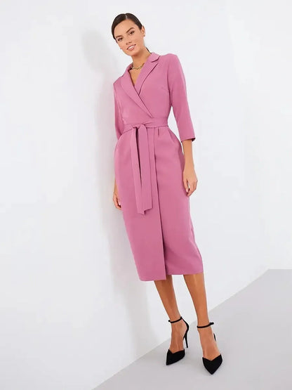Blush wrap midi dress with belted waist and three-quarter sleeves, perfect for weddings and formal occasions.