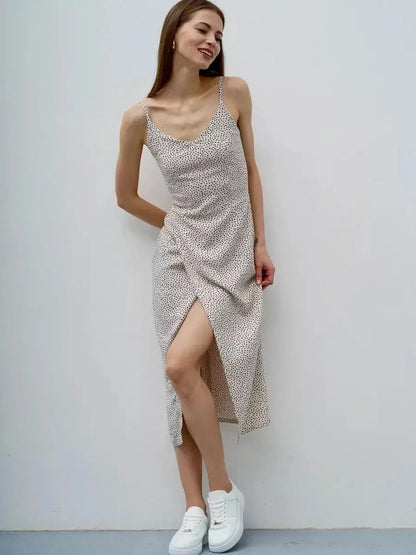Model wearing a lightweight Dot Whisper Midi Dress with polka dots, perfect for summer, weddings, and casual outings.