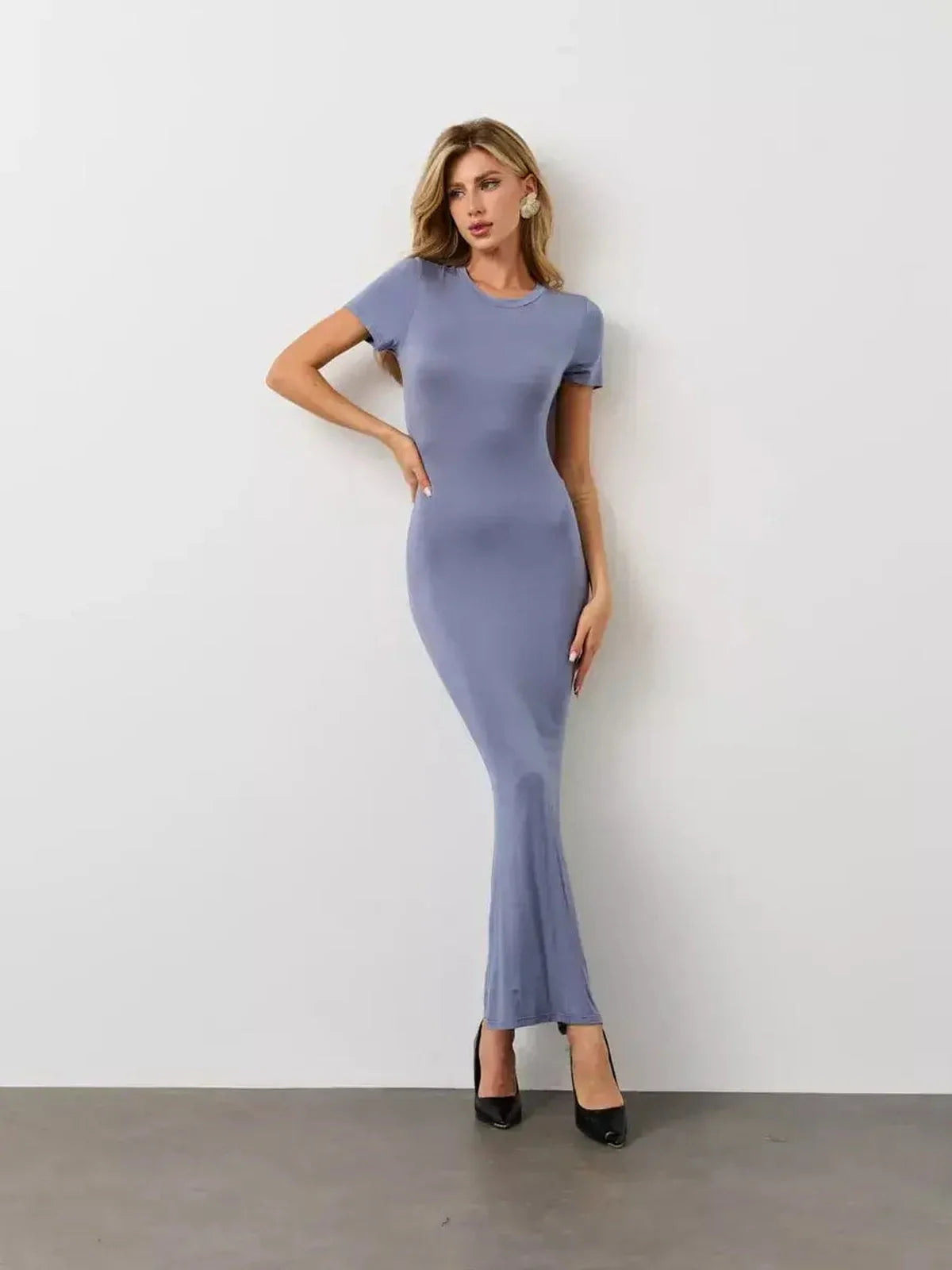 Cloudline Maxi Dress in soft blue showcasing a streamlined silhouette and U-neckline, perfect for summer or formal occasions.