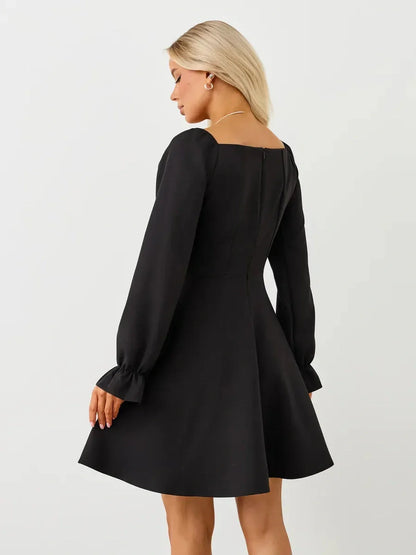 Elegant black velvet hour mini dress featuring a square neckline and voluminous long sleeves, perfect for special occasions.