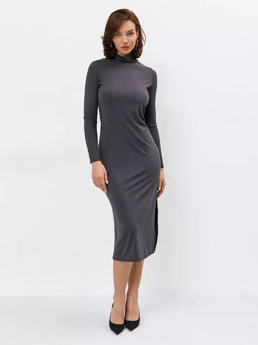 Elegantly modeling the Sculpt Midi Dress in anthracite grey, featuring a high mock neck and side slit for modern allure.