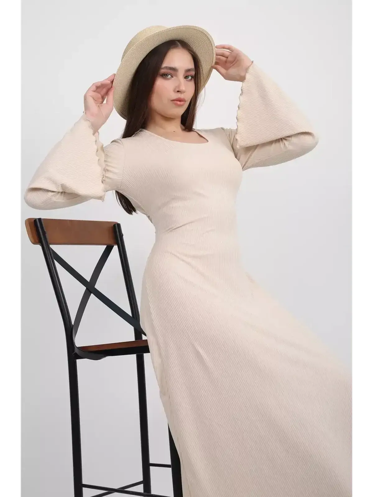 Model showcasing the Ivory Flow Midi Dress with bell sleeves, perfect for weddings and formal occasions.