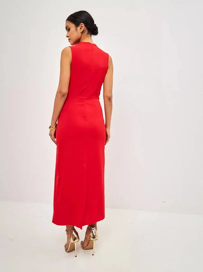 Back view of a woman wearing a red drape maxi dress, showcasing its elegant silhouette and stylish design.