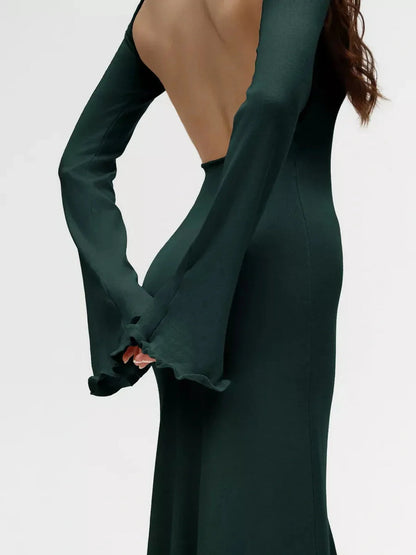 The back view of the Serenity Knit Midi Dress featuring flounced sleeves and an elegant open back, perfect for evening events.