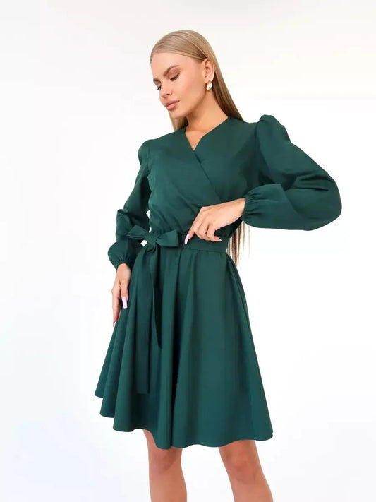 Emerald Charm mini dress featuring a flattering wrap-style bodice and V-neckline, ideal for summer weddings and formal events.