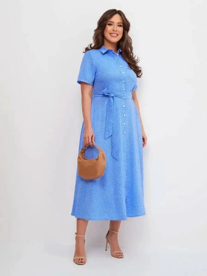 Skyline Dot Midi Dress in light blue, featuring a button front and adjustable waist, perfect for summer weddings and casual outings.