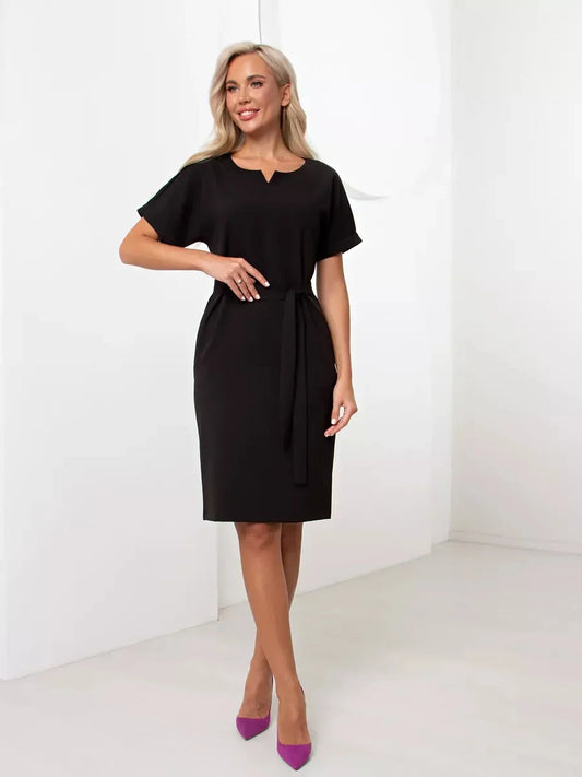 Elegant black mini dress with short sleeves and self-tie belt, perfect for weddings and casual occasions.
