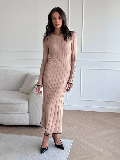 Sahara Curve Maxi Dress in Sandstone Beige, featuring a soft ribbed texture and elegant full-length silhouette.