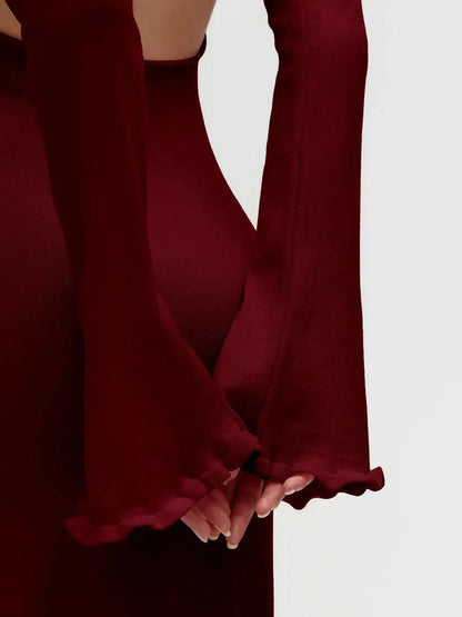 Close-up of Ruffle-Back Midi Dress showcasing elegant long sleeves and delicate ruffled trim in burgundy.
