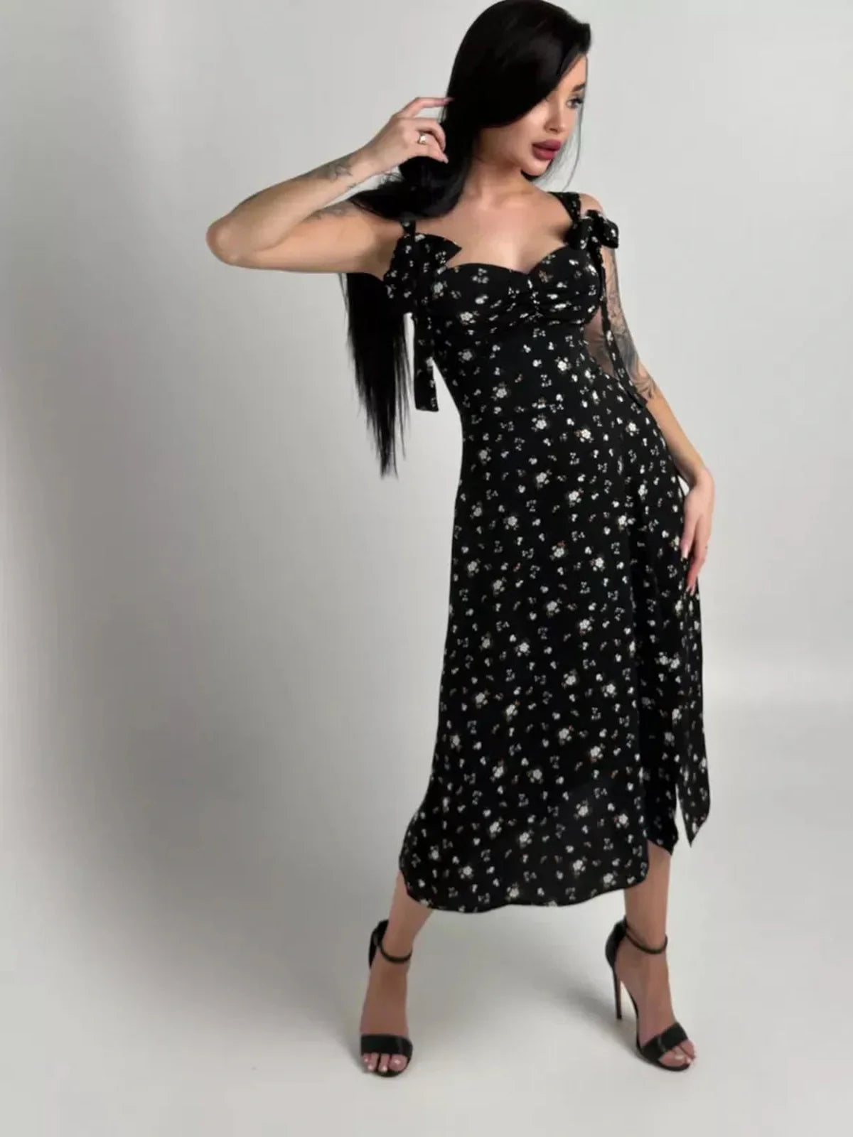 Elegant black floral Elysian Midi Dress with romantic bows, perfect for summer weddings and special occasions.