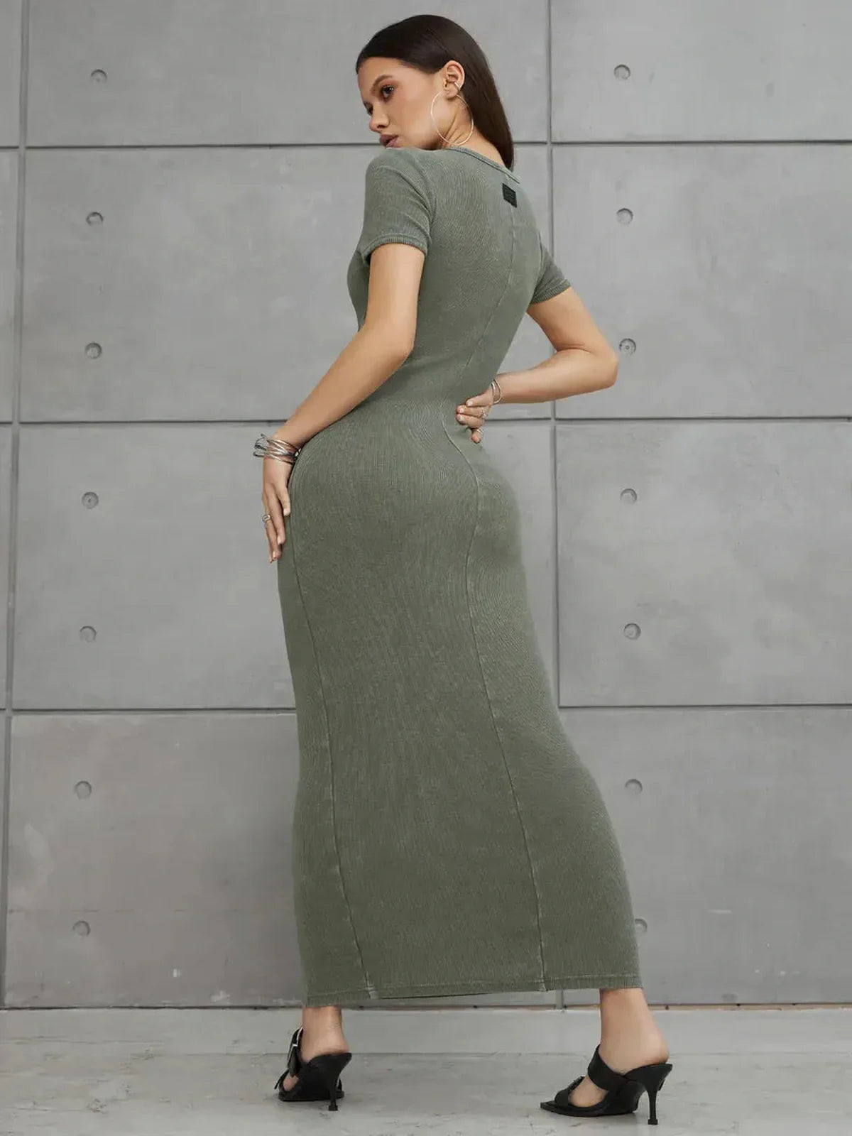Olive Line Maxi Dress in khaki green ribbed cotton, featuring a form-hugging silhouette and short sleeves.