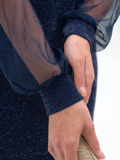 Close-up of the sheer sleeves and lurex detailing on the Celeste Midi Dress in navy, showcasing elegant style.