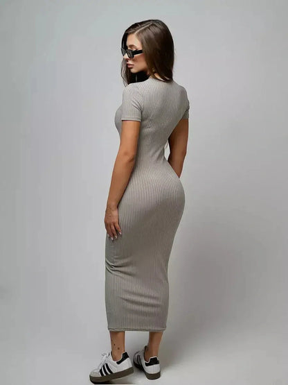 Model showcasing the Sculpted Grace Maxi Dress in ribbed fabric, exuding elegance and modern style.