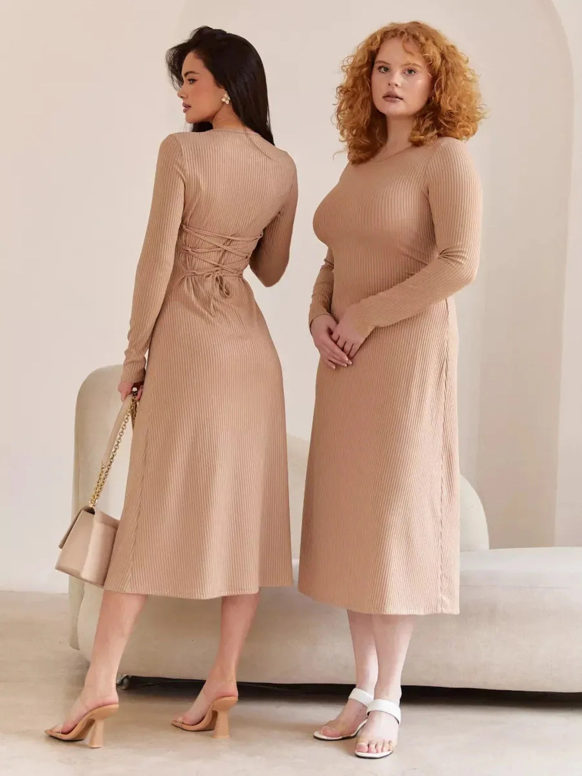 Two models showcasing the Laced Elegance Midi Dress in beige, featuring a sculpted fit and lace-up waist design.