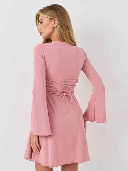 Back view of a pink mini dress with flared sleeves and a tie detail, perfect for summer dresses or wedding guest outfits.