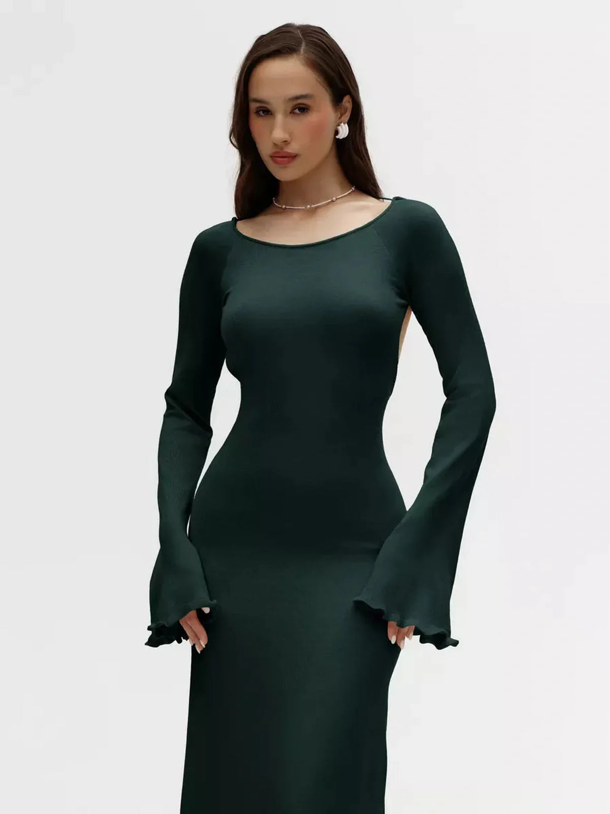 Serenity Knit Midi Dress in dark green with open back and flounced sleeves, perfect for weddings and evening events.