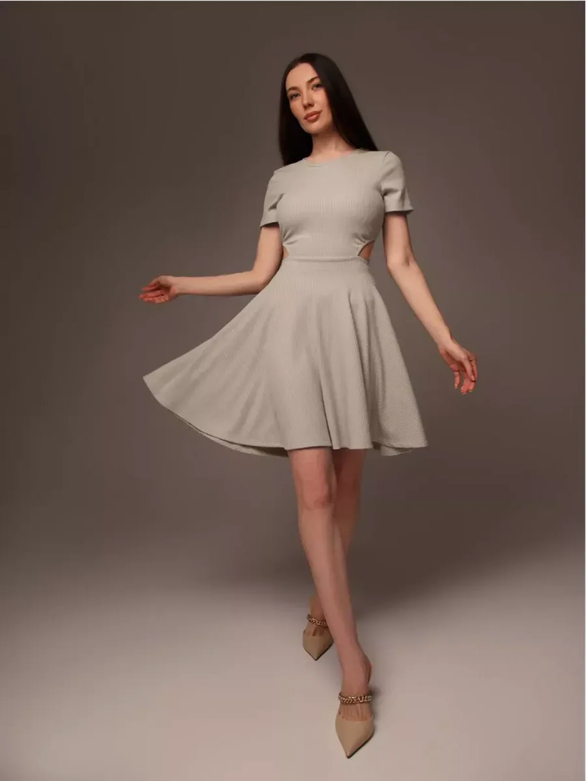Model showcasing the Breezy Hour mini dress, a stylish and breathable fit perfect for summer occasions.